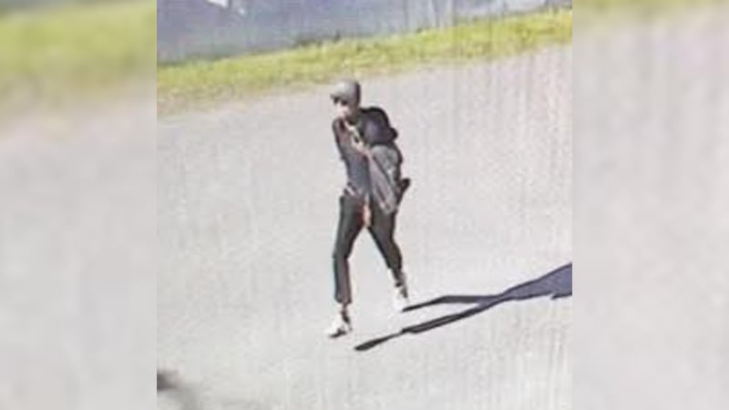 The suspect, described by police as a short, thin man with red hair, had not been found as of...