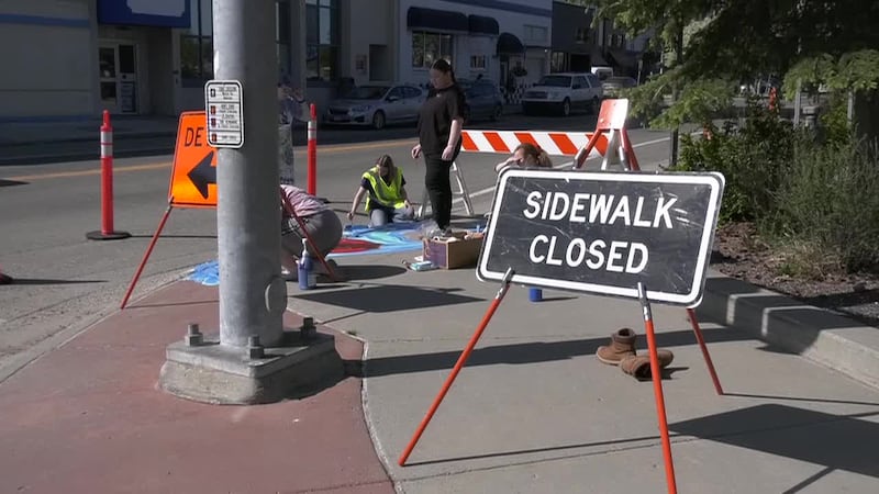 Volunteer painters beautify downtown Fairbanks near Golden Heart Plaza